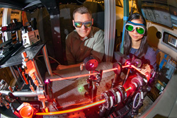 Daniel Richardson and Yibin Zhang observe a laser that records measurements in hypersonic wind tunnel.