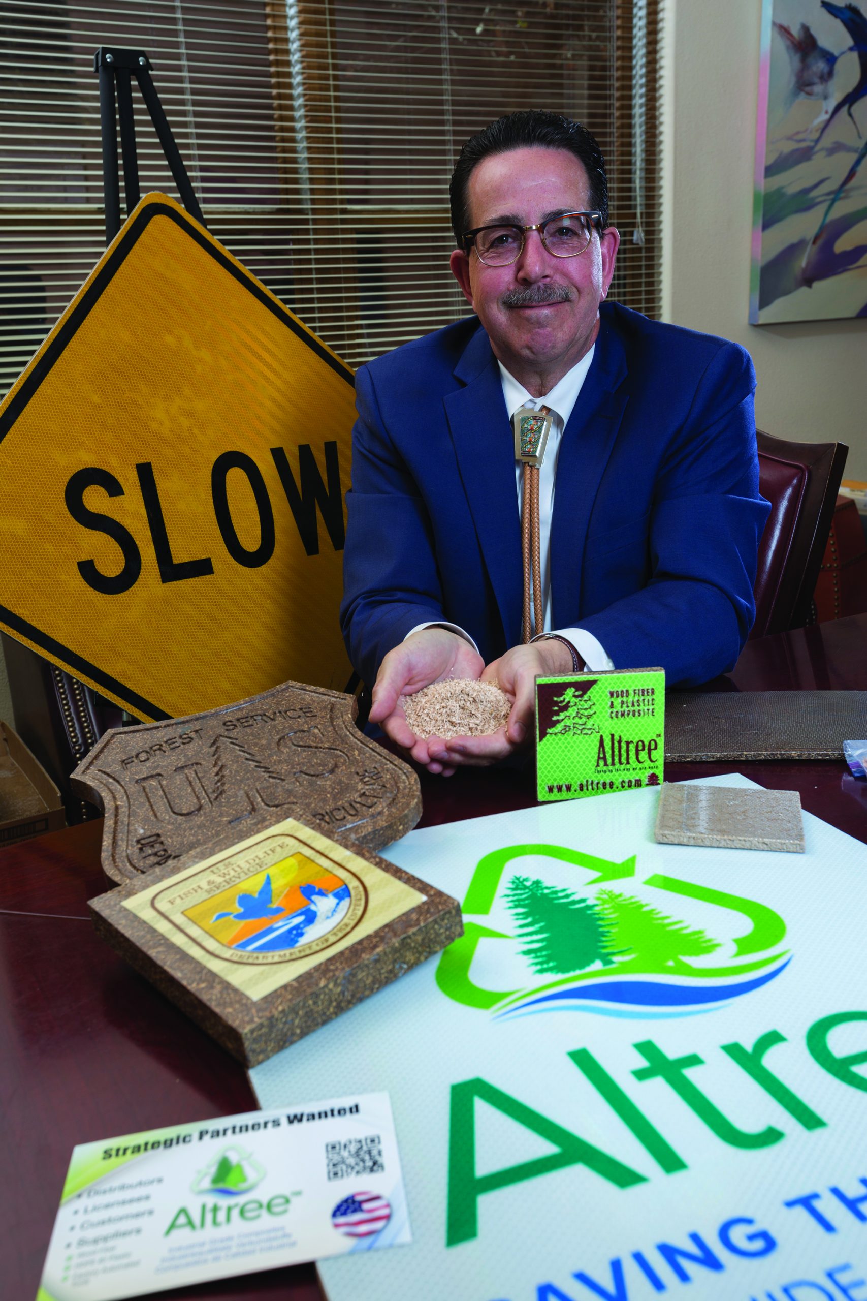Tony Burger, managing director of PJ Woodlands, displays samples of Altree, holding a handful of wood fiber.