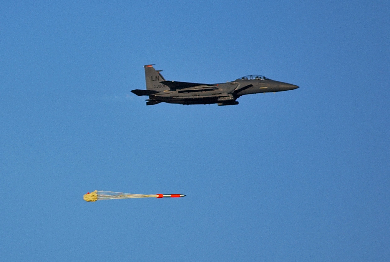 A joint test assembly undergoes a flight test at Sandia National Laboratories' Tonopah Test Range in Nevada. The test unit began as a B61-4, which was removed from the stockpile, disassembled and used to build the non-nuclear test assembly to collect performance data during flight environments similar to operational conditions.