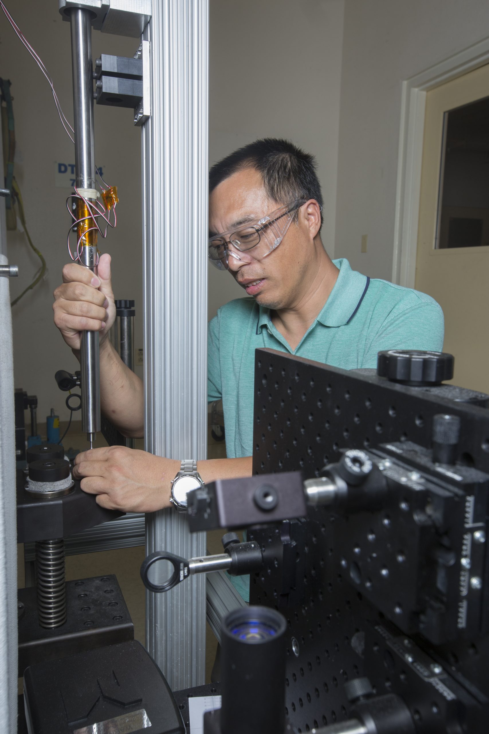 Bo Song working in his impact mechanics lab at Sandia National Laboratories.