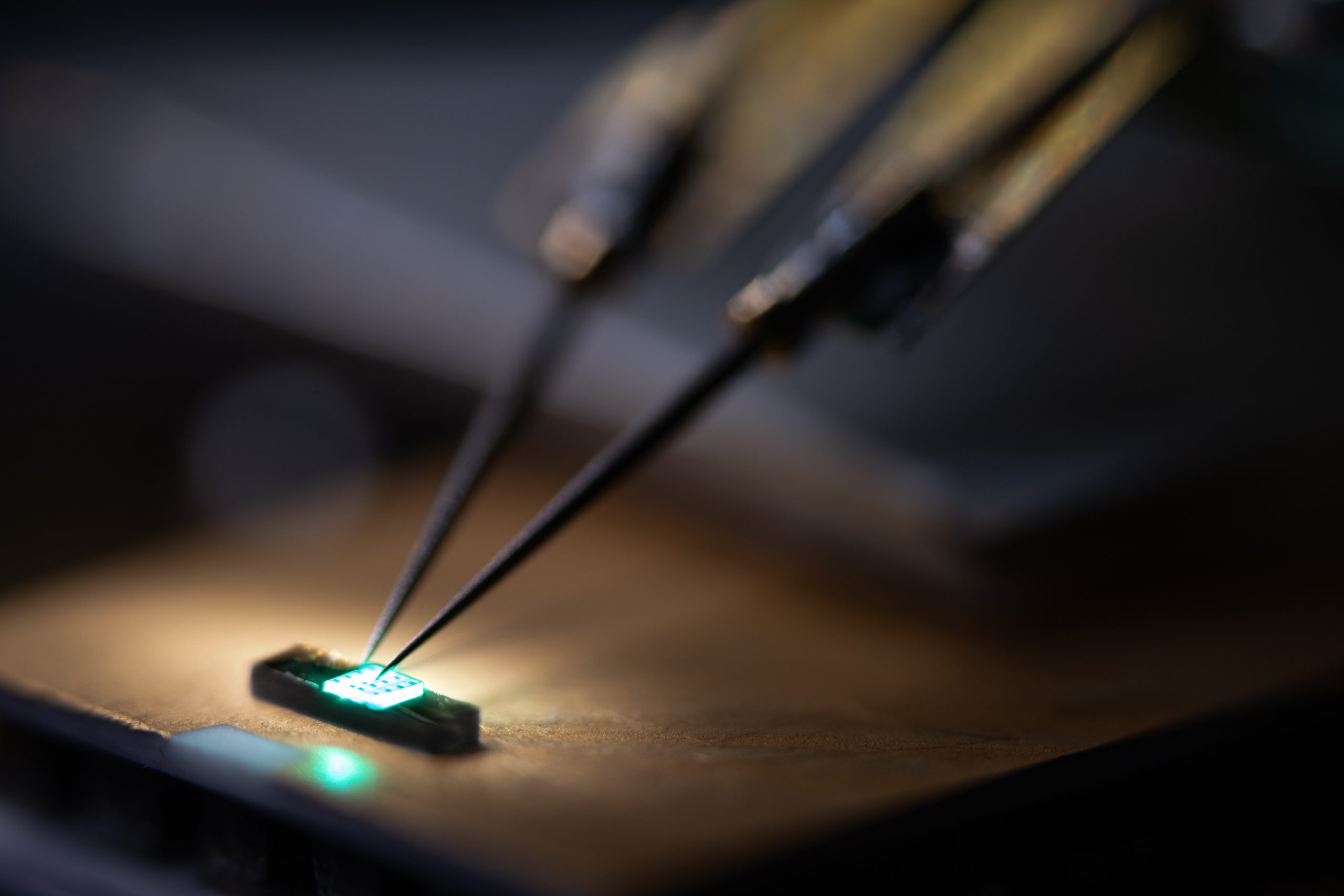 A probe is used to test a green indium gallium nitride laser diode being developed at Sandia National Laboratories for next-generation quantum sensors.
