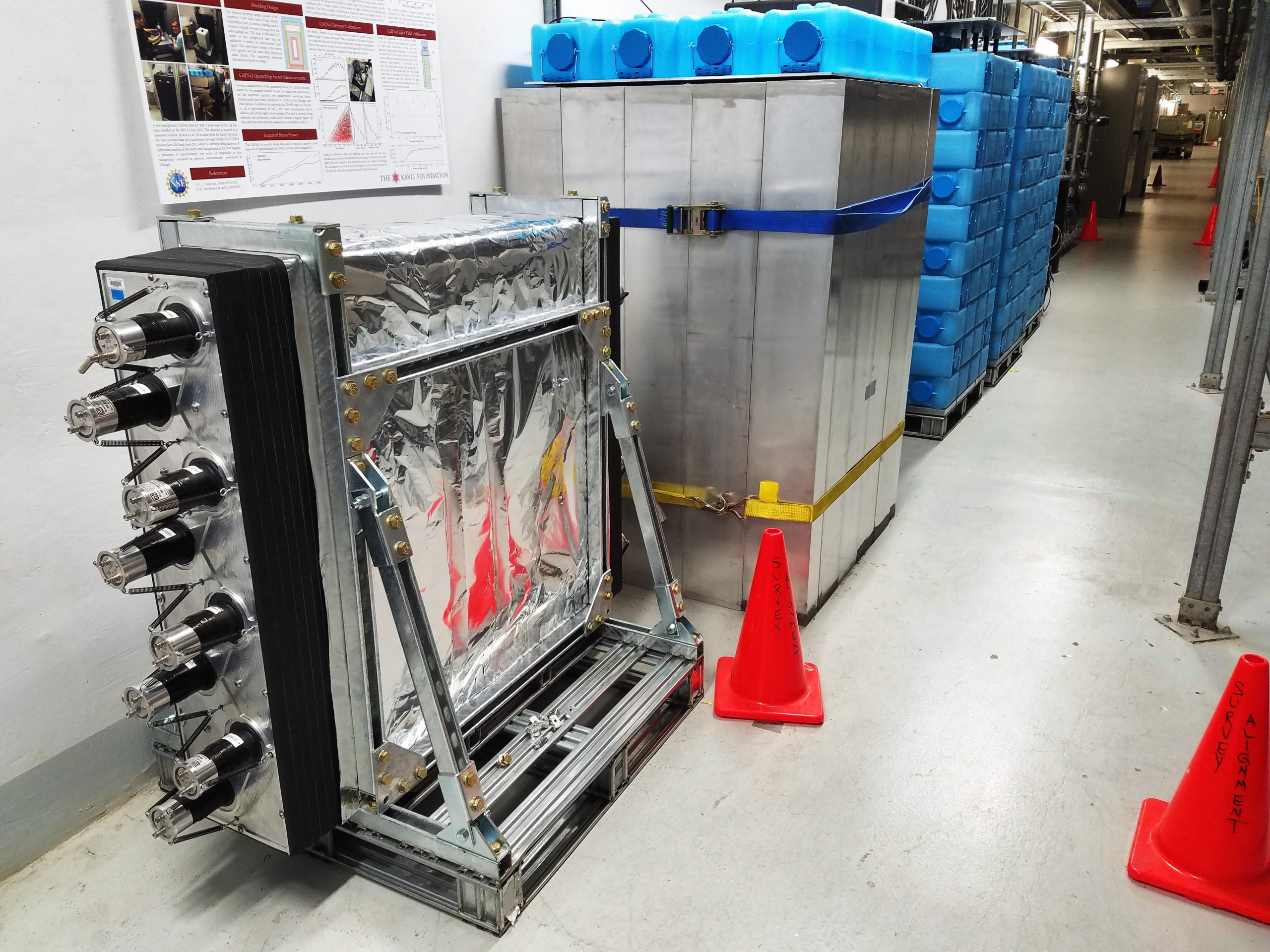 The detector on the left is the Sandia National Laboratories module for neutron monitoring. The adjacent box is the shielding enclosure for the CsI detector that produced the results included in this publication. In the background are more of the collaboration's detector systems that are currently taking data.