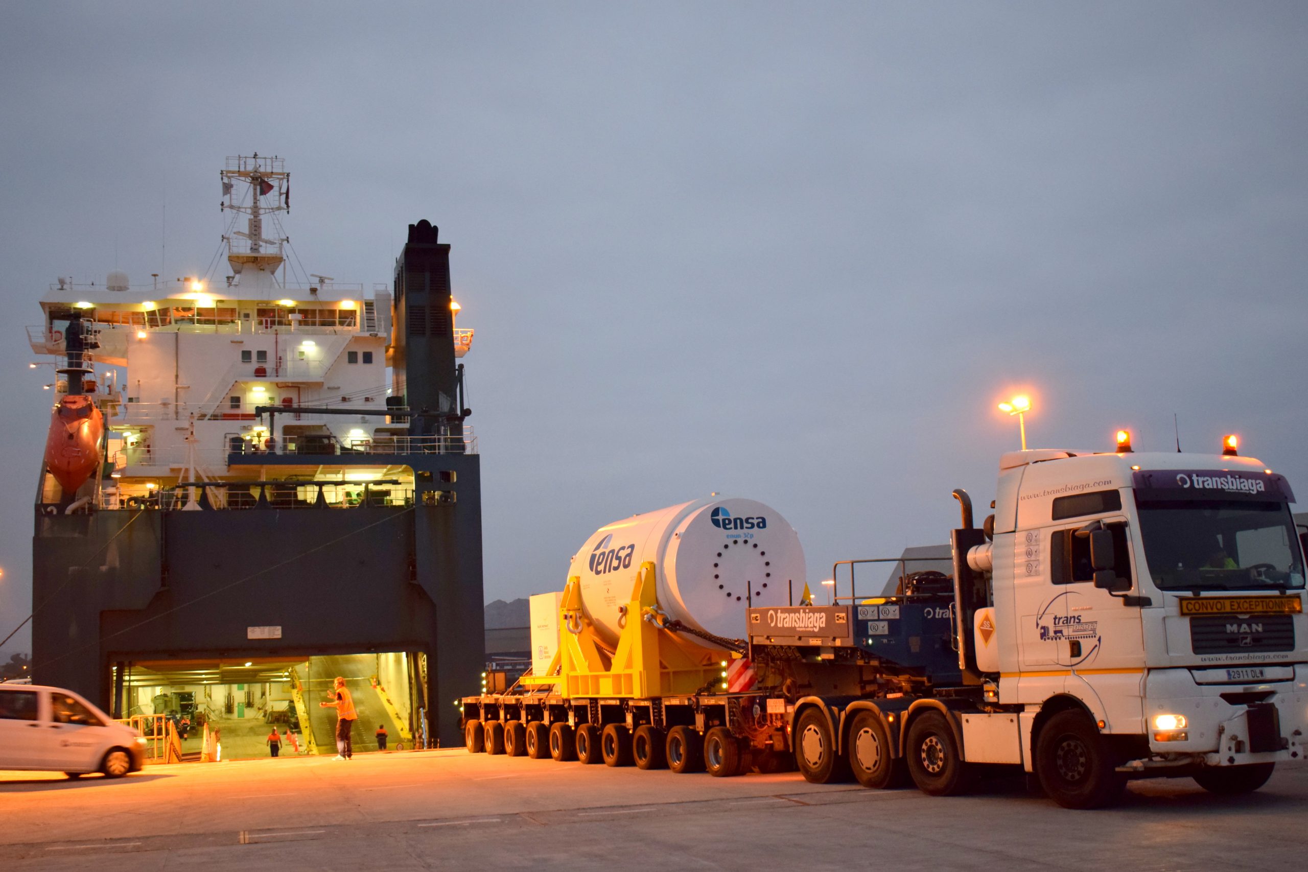 Loading the nuclear waste transportation and storage cask with three surrogate fuel rod assemblies onto a barge for the second leg of Sandia National Laboratories' triathlon.