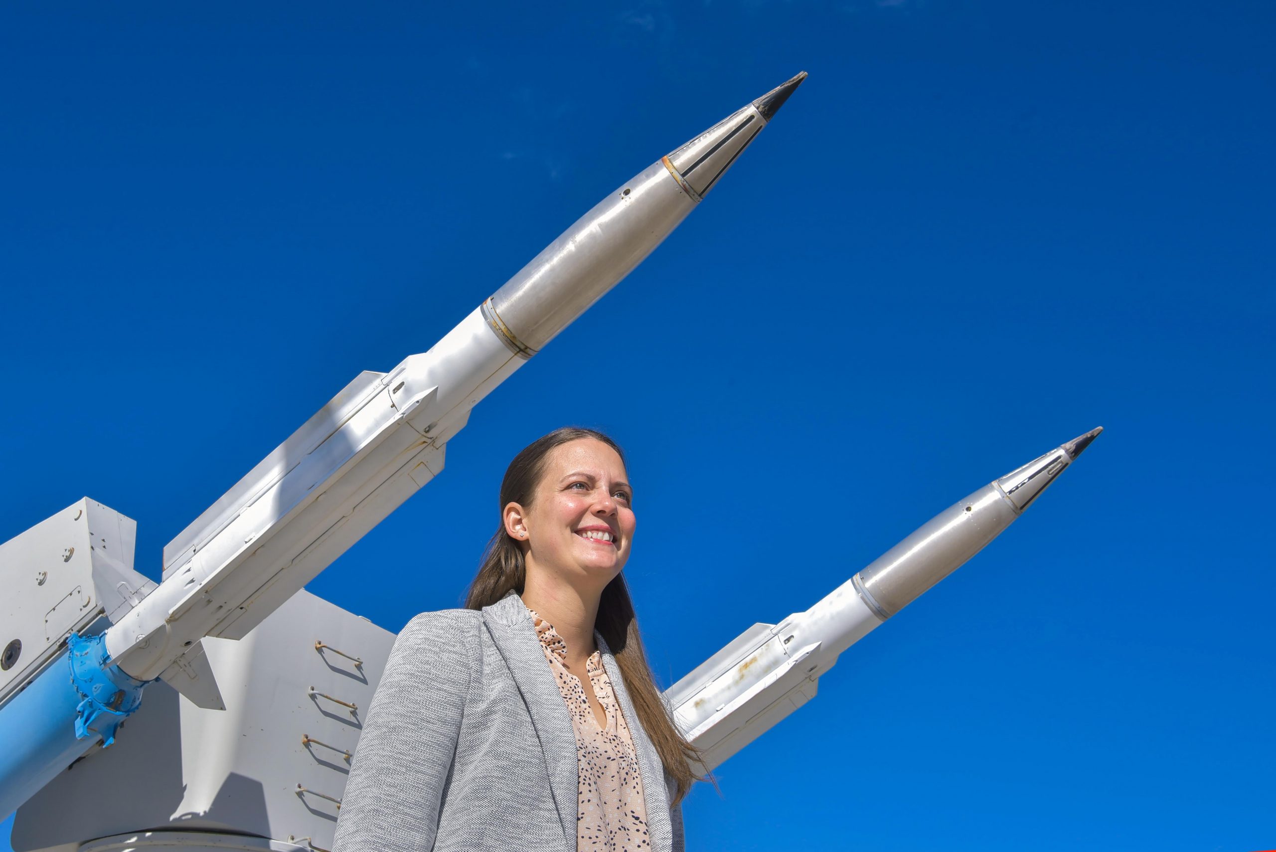 U.S. Air Force Capt. Justine Wolff, an Education With Industry student hosted by Sandia National Laboratories, stands in front of the Terrier Missile display at the National Museum of Nuclear Science & History in Albuquerque.