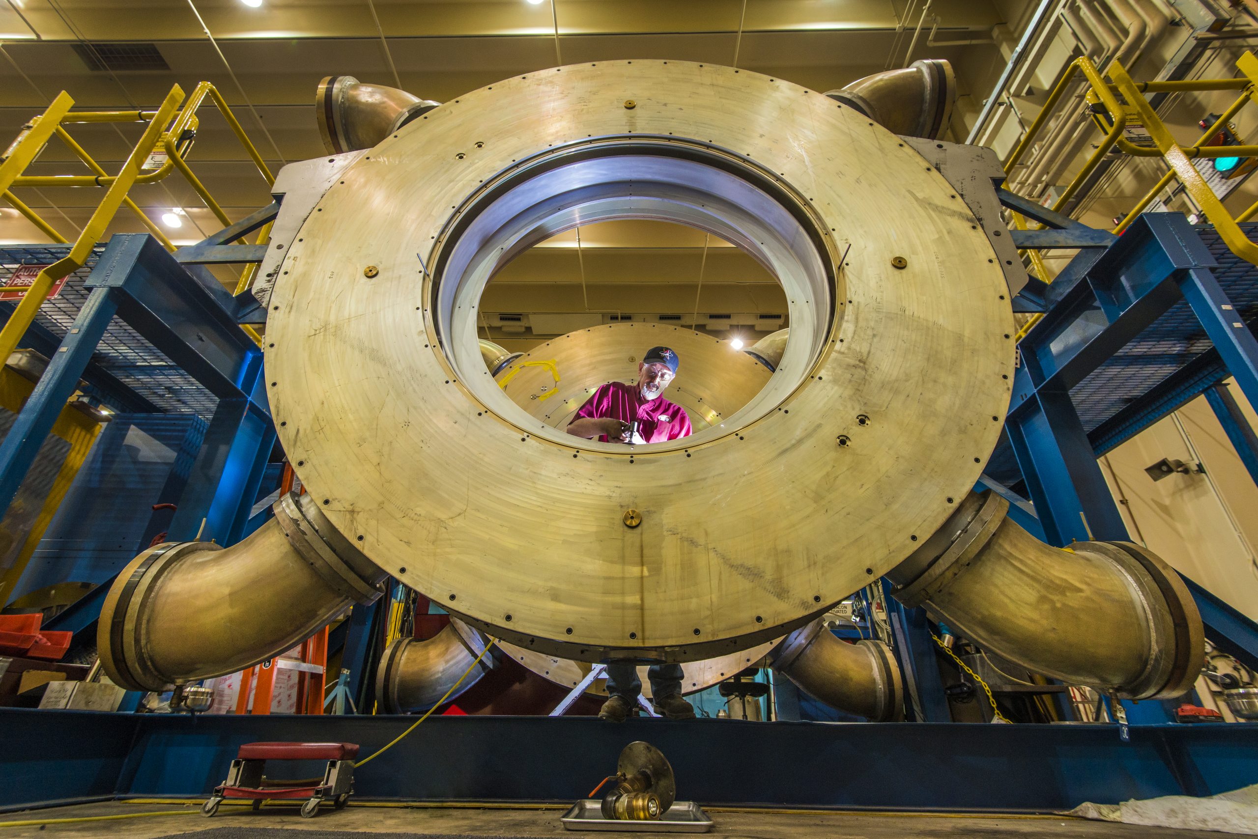 Technician Gary Tilley at Sandia Labs repairs a cavity at HERMES  III.