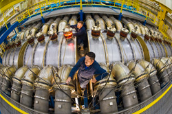 Gamma ray generator HERMES III, High-Energy Radiation Megavolt Electron Source, is adjusted for its next shot at Sandia National Laboratories by Chris Kirtley, top, and former Sandia employee JJ Montoya.