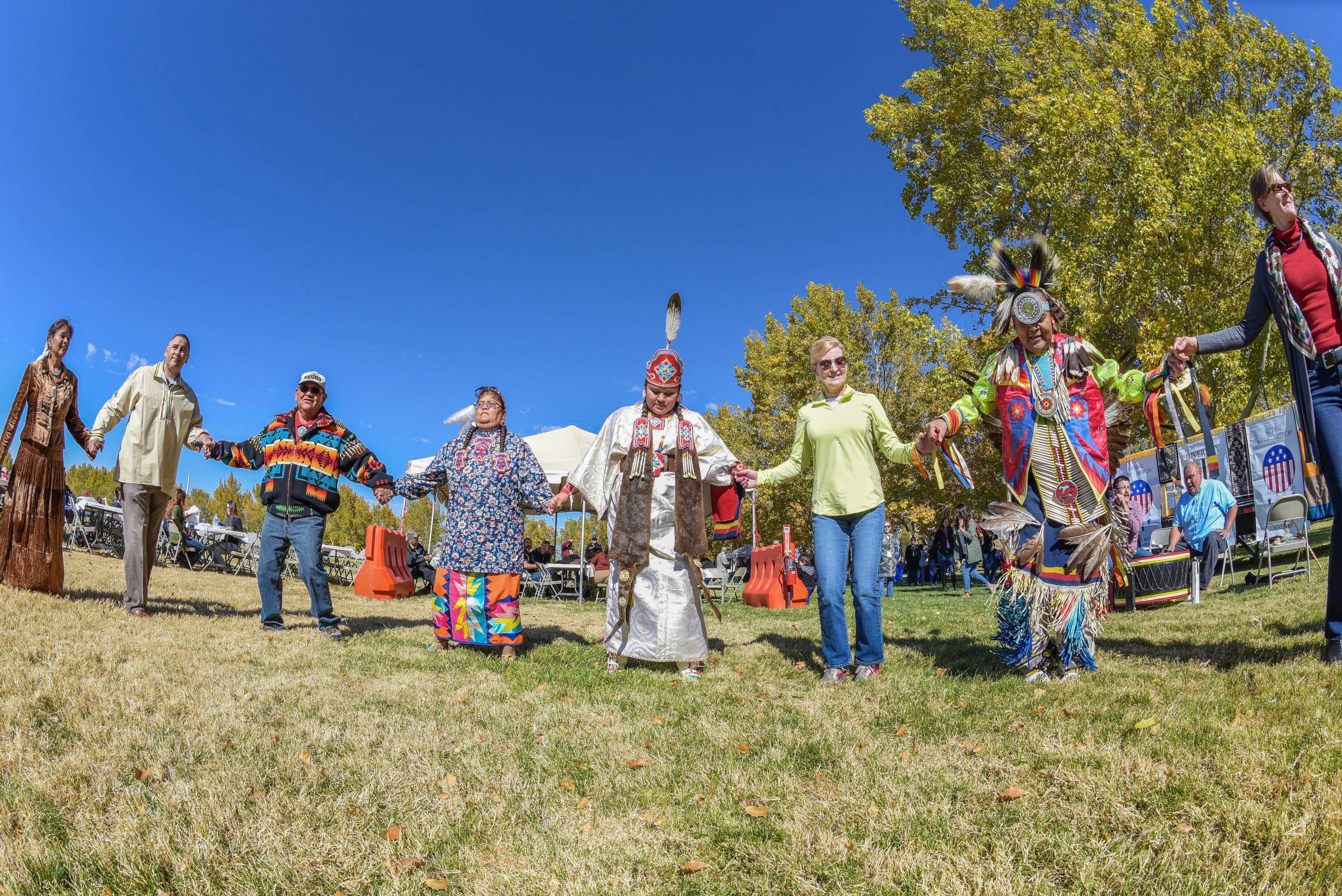 Back before social distancing, Sandia National Laboratories employees and members of the Navajo Nation’s Hogback, New Mexico, dance group celebrated Native American Heritage Month in November 2017.