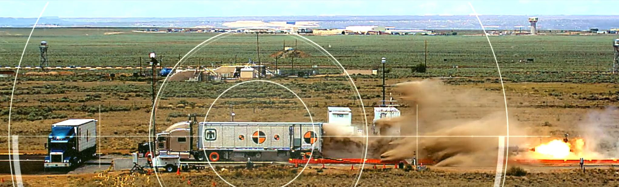 Using the Sandia National Laboratories’ sled track, rockets propelled the semitractor-trailer at highway speeds into a prototype of an over-the-road Mobile Guardian Transporter conceptualized and built from scratch.