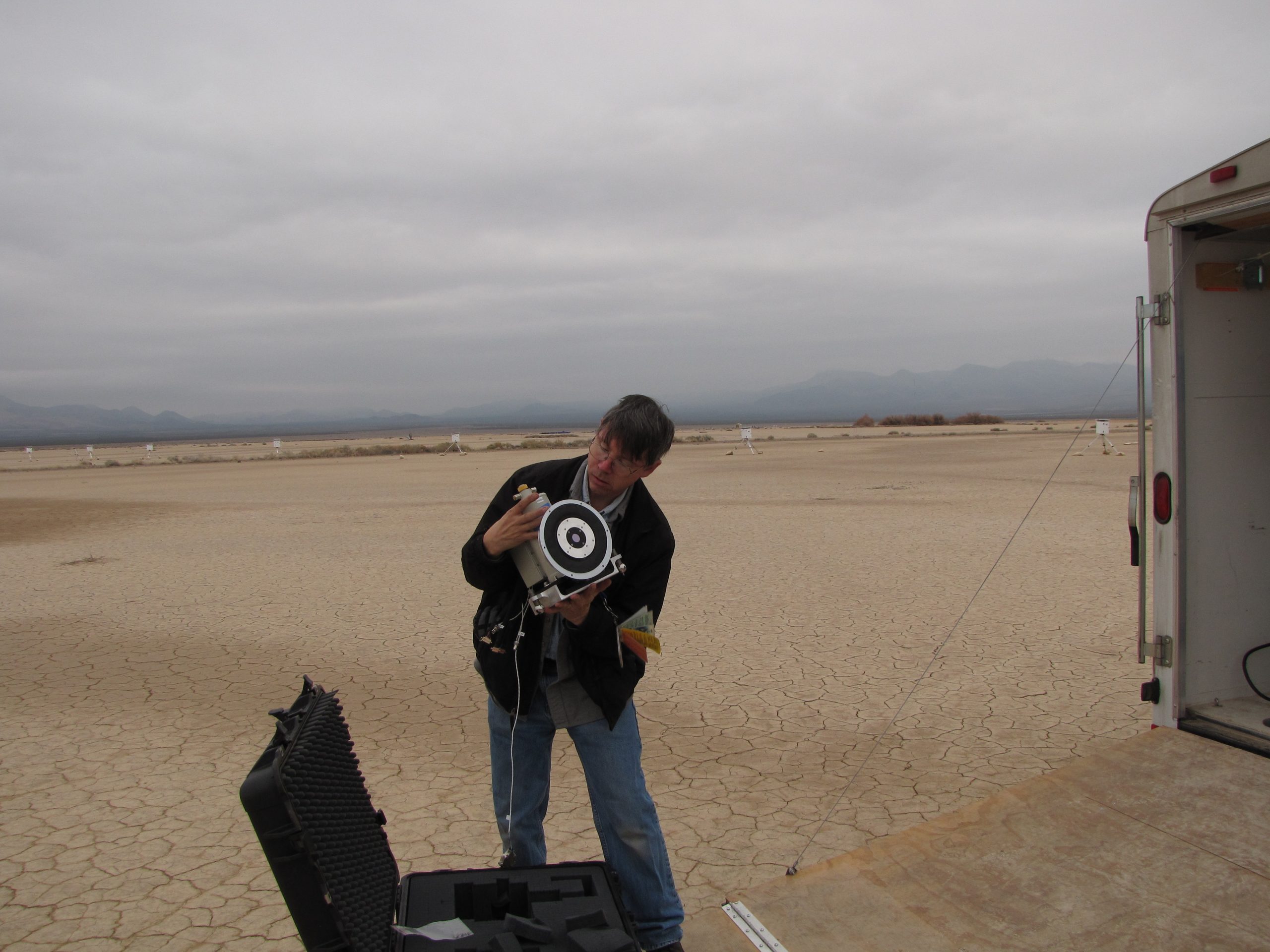 Sandia National Laboratories’ Todd Embree inspects one of the Neptune sensor’s two liquid-nitrogen-cooled cameras before field installation. Neptune underwent field testing in Nevada in December 2012.