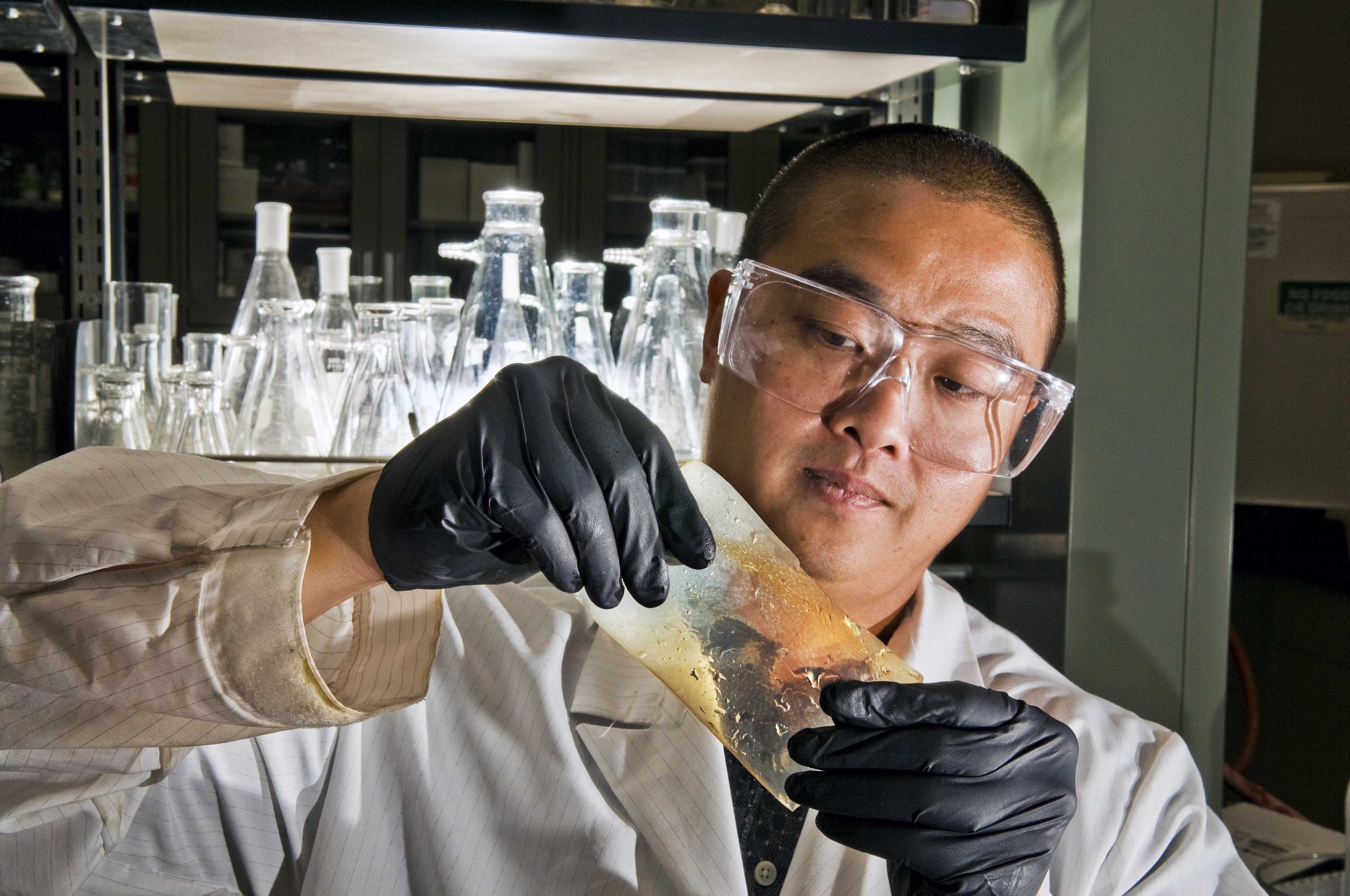 Sandia researcher Cy Fujimoto demonstrates his new flexible hydrocarbon polymer electrolyte membrane, which could be a key factor in realizing a hydrogen car.