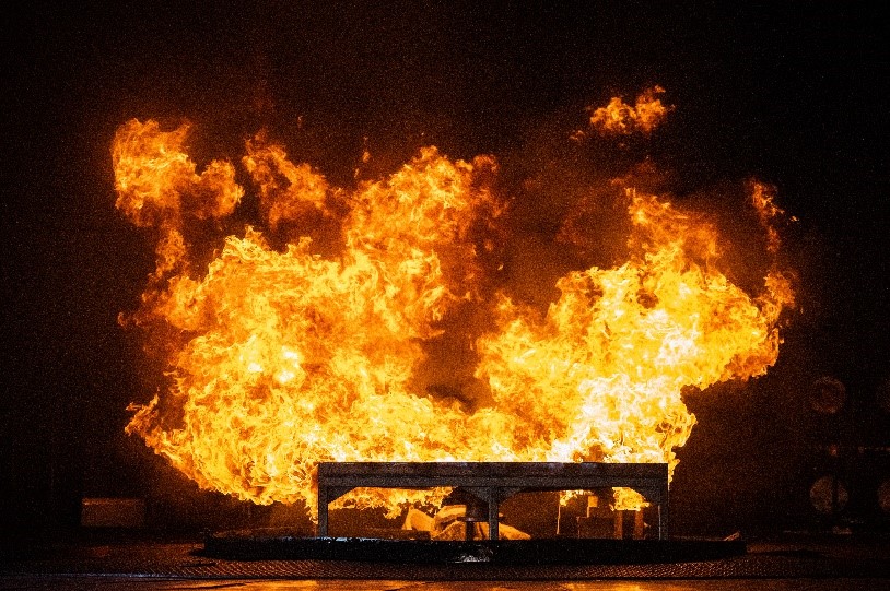 A 2-by-2-meter pool of aviation fuel burns during a demonstration at the Thermal Test Complex at Kids Day at Sandia National Laboratories.