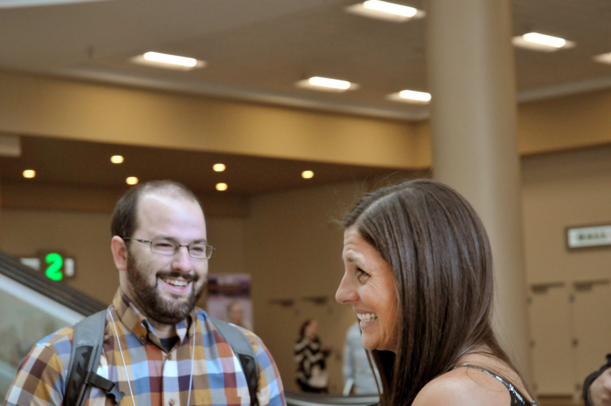 Sandia National Laboratories biorisk management expert Will Pinard chats with Melissa Morland, assistant director and biosafety officer at the University of Maryland, Baltimore, who has been a twin in every Biosafety Twinning Program class, at the 2017 American Biological Safety Association conference.