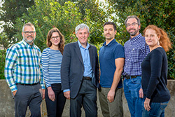 Professor of Atmospheric Chemistry at the University of Leeds Dwayne Heard, third from left, recently visited Sandia National Laboratories’ Combustion Research Center. From left, Craig Taatjes, Rebecca Caravan, Heard, Lenny Sheps, David Osborn and Judit Zador.