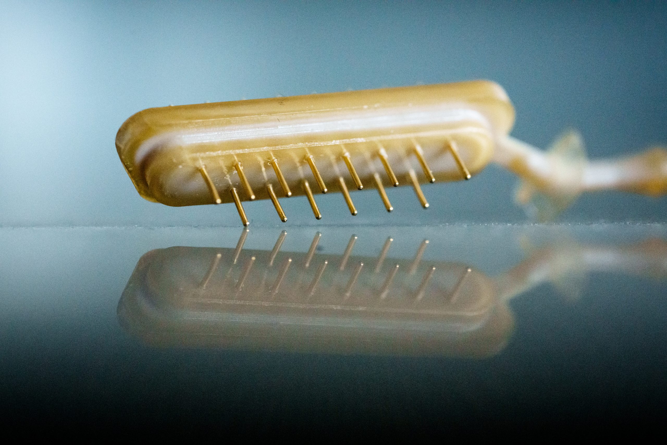 The injection-molded PEEK insert was made using a 3D-printed molding tool at Sandia National Labs' Advanced Materials Lab. The Rapid Development Connectors Program is focused on fabricating custom electronic connectors for weapons systems in less than a month.