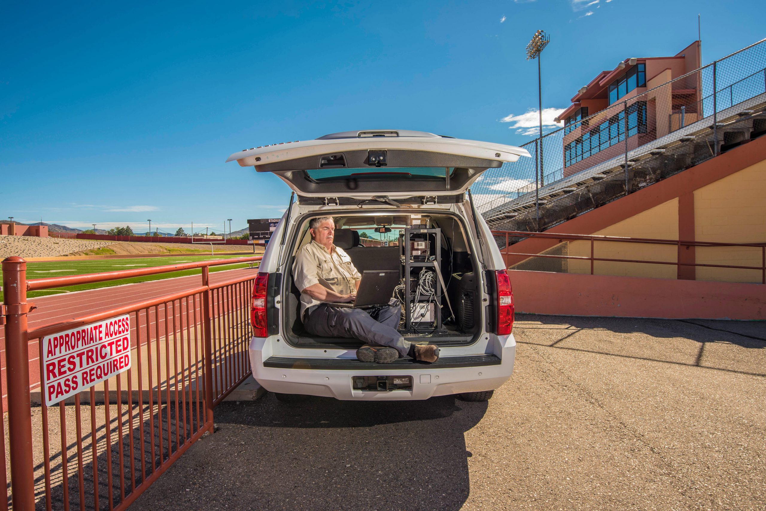 Sandia National Laboratories Radiological Assistance Program senior scientist Richard Stump monitors a football field with a super-sensitive, vehicle-mounted radiation detector.