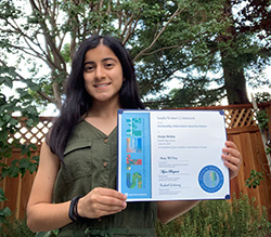 Pooja Mehta, a student at Foothill High School in Pleasanton, California, with her award for outstanding achievement in science following the annual Math & Science Awards recognition event at Sandia's California site.