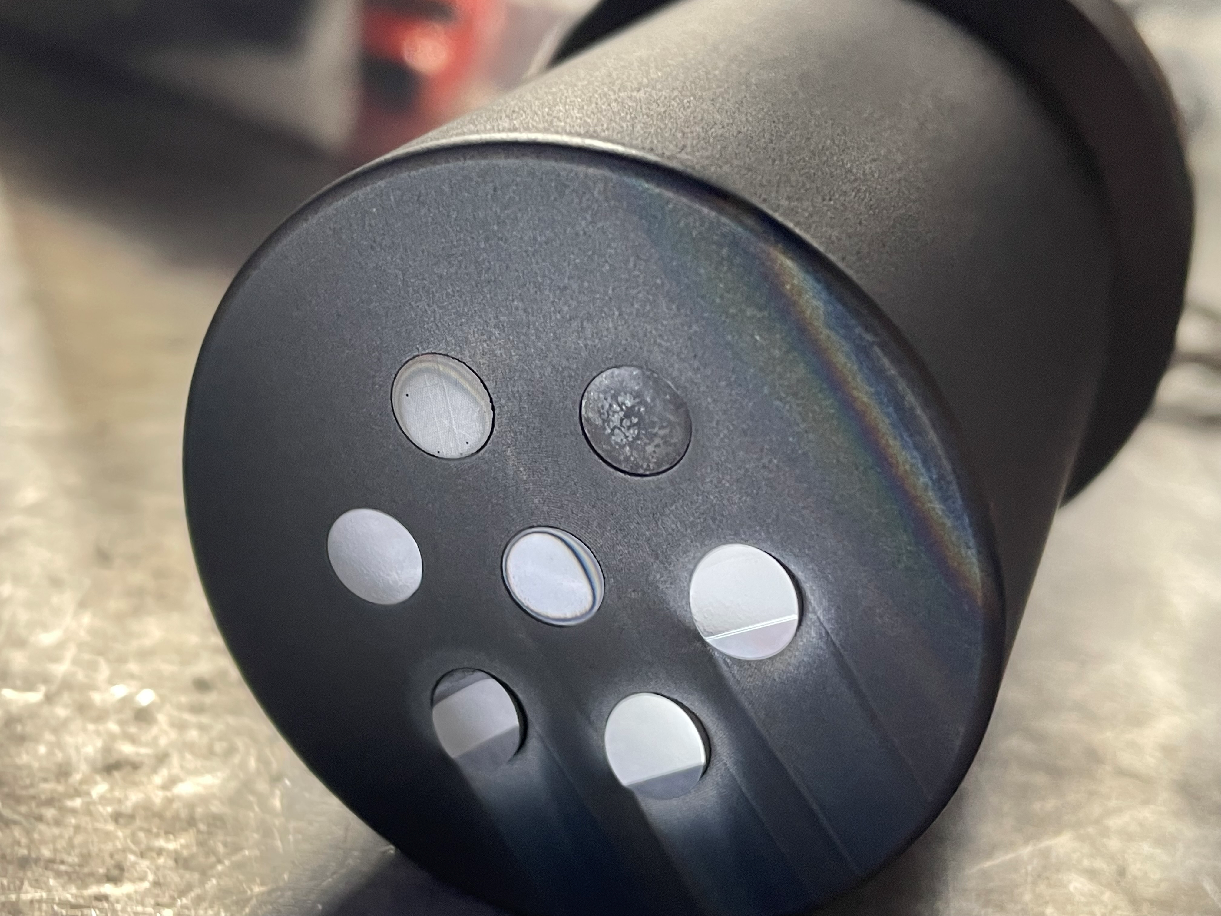 A team of Sandia National Laboratories researchers is testing materials to make the next generation of fusion reactors. This container is used to expose the samples to nuclear fusion. It holds seven samples of innovative tungsten alloys, post exposure.