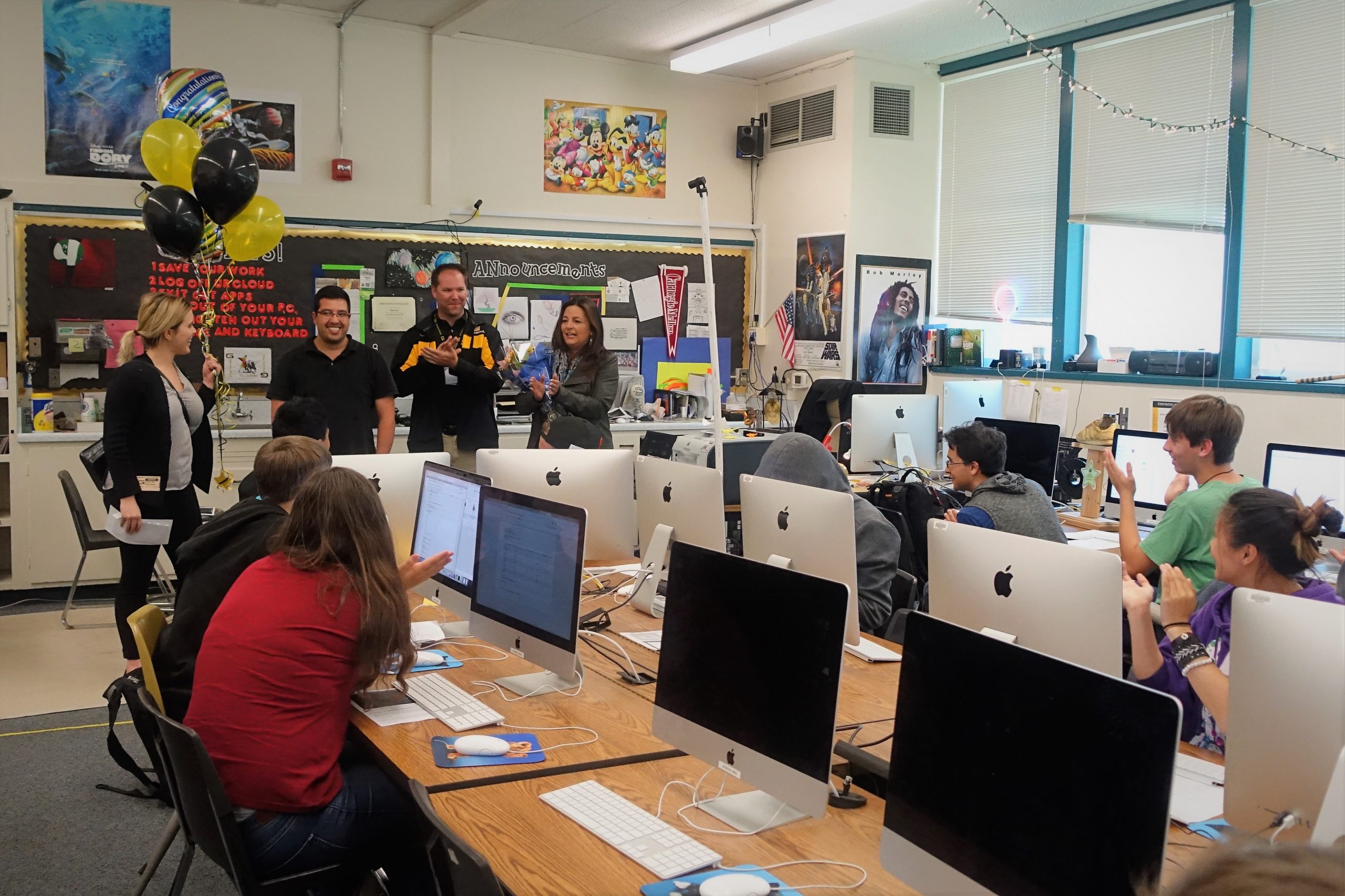 Granada High School students try to figure out why their principal had entered their classroom as their teacher Miguel Baez receives the 2018 Sandia National Laboratories Excellence in Teaching Award.