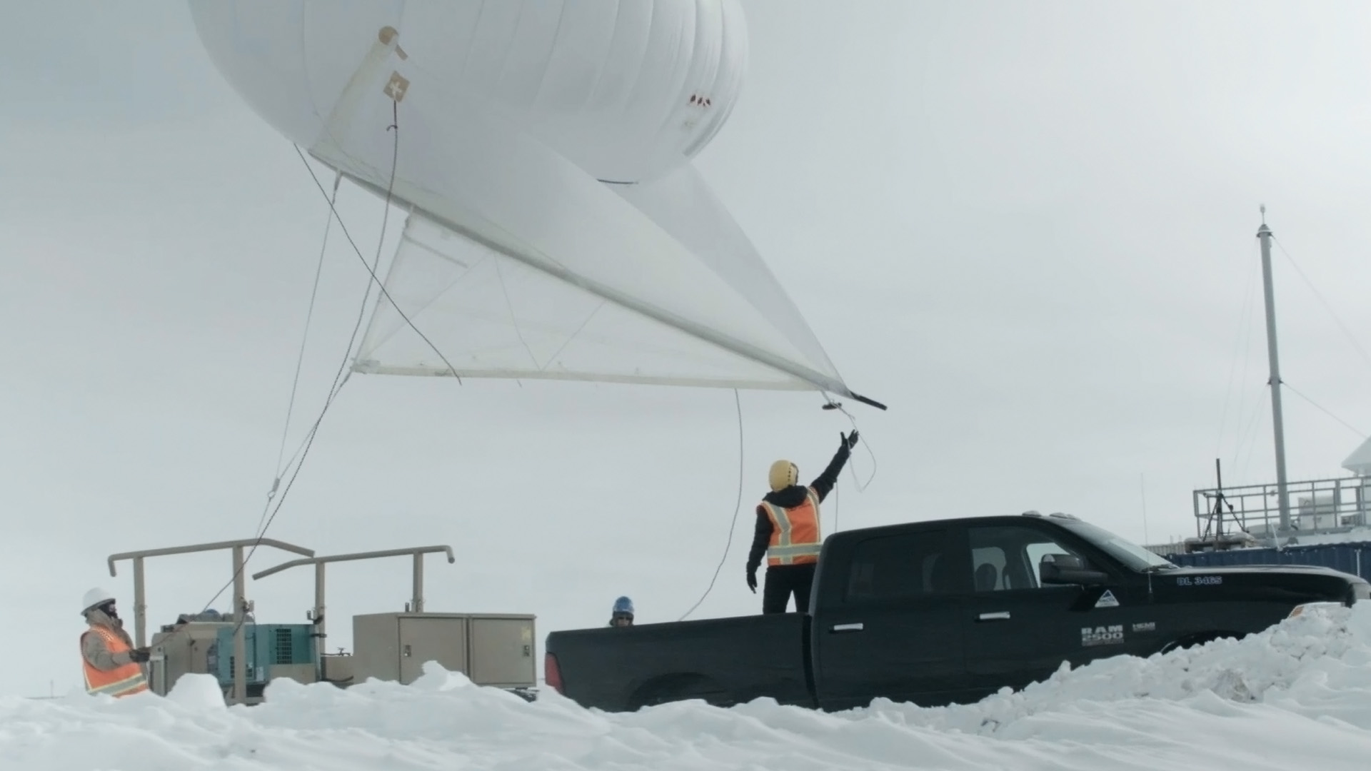 Dari Dexheimer, a Sandia National Laboratories atmospheric scientist, and her team prepare to launch a 13-foot-tall tethered balloon, also known as a helikite, from ARM’s Oliktok facility.