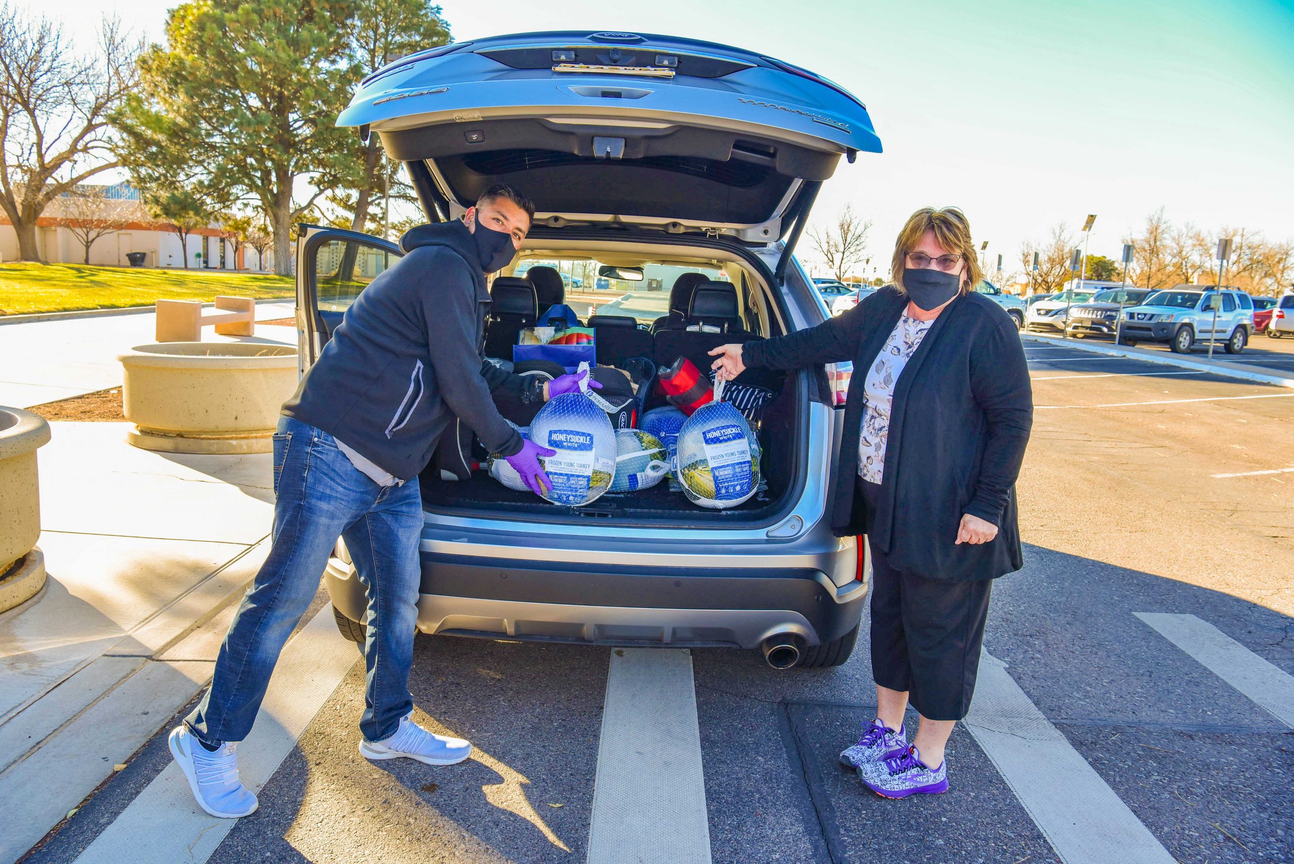 Sandia National Laboratories employee Mardelle Morrow, right, dropped off six turkeys at Sandia this year, with the help of volunteer Chris Hulliger. Morrow has donated turkeys for the last 17 years. Sandia employees have donated at least 5,000 turkeys over the past 20 years to be shared by local food banks with those in need in Albuquerque and surrounding communities.