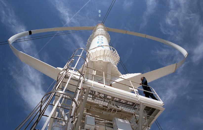 A historical photo of Sandia National Laboratories’ experimental 34-meter-diameter, vertical-axis wind turbine built in Texas in the 1980s.