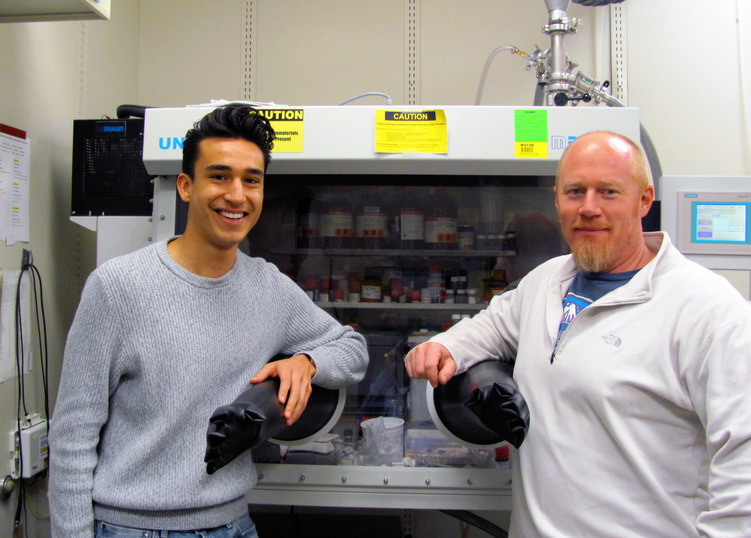 Sandia National Laboratories student intern Julian Vigil, left, published his first technical paper in 2013 with mentor Tim Lambert, right, and a Rice University professor, while still in high school. Now, Vigil and Lambert have won a 2017 American Chemical Society