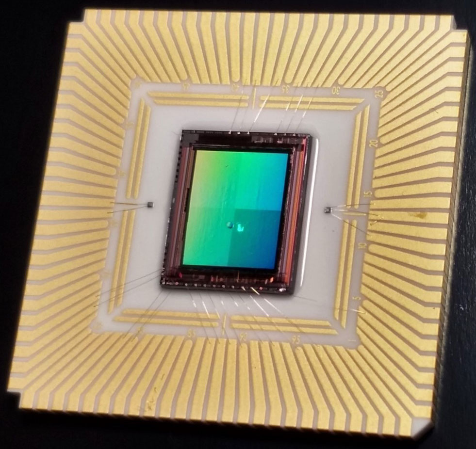 Sandia National Laboratories’ nanoantenna-enabled detector on an assembled focal plane array for a thermal infrared camera. The gold nanoantennas are so small they aren’t visible on top of the detector array.