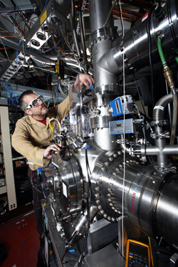 Combustion expert Craig Taatjes adjusts a multiplexed chemical kinetics reactor at the Advanced Light Source at Lawrence Berkeley National Laboratory. Sandia's unique machine probes individual chemical reactions with isomeric resolution. Experiments on this machine will help examine the fundamental autoignition chemistry of potential new biofuels.