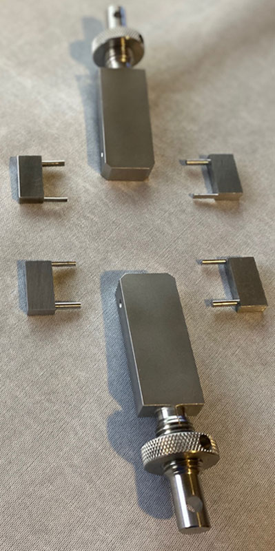 Sandia National Laboratories researcher Tim Briggs invented a set of fracture testing hangers to help his team perform fracture tests, rapidly accelerating the speed of such testing.