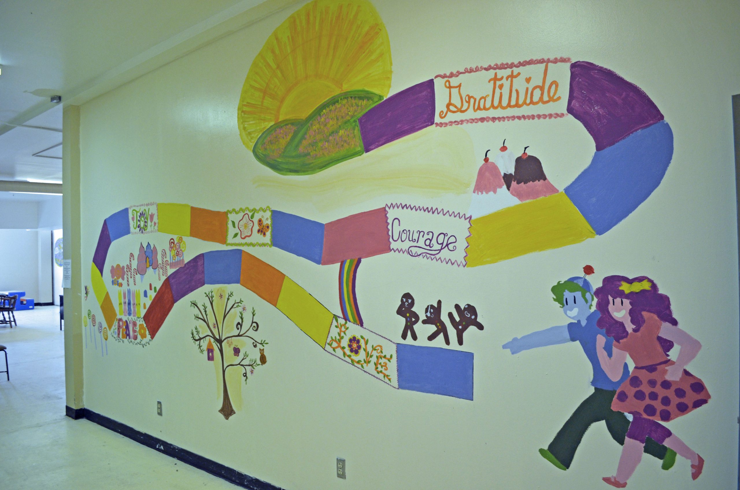 Girl Scout Troop 47, led by Sandia National Laboratories physicist Rosalie Multari, decided to renovate the city's former jail-turned-homeless-shelter in 2016 as part of a scouting project aimed at taking action in the community. The girls spent thousands of hours revamping the facility, including painting inspirational words and images throughout the living areas.