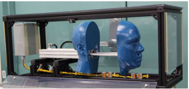 The team’s mechanical test fixture that supports reuse testing, including donning cycles, speed, and mask displacement.