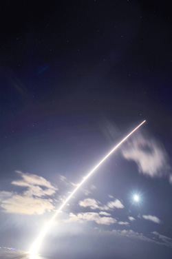 A target for the Navy's newest interceptor missile crosses the night sky after taking off from a vertical launcher at the Pacific Missile Range Facility's tenant, Sandia's Kauai Test Facility. 