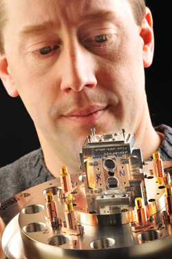 Marcus Knudson examines the focal point of his team's effort to characterize materials at extremely high pressures. The fortress-like box sitting atop its support will hold within it a so-called 