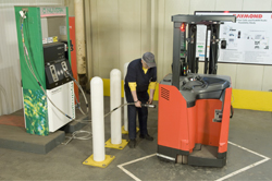 A PowerEdge fuel cell-powered forklift truck is refueled at Nuveras PowerTap hydrogen dispenser. An April 28 workshop organized by Sandia will help identify the key areas of R&D that are necessary to enable the deployment of hydrogen fuel cell systems for industrial trucks and other applications. (Photo courtesy Nuvera Fuel Cells)