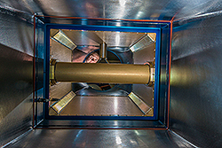 A researcher checks air flow in the Harvester particulate sampling pod.