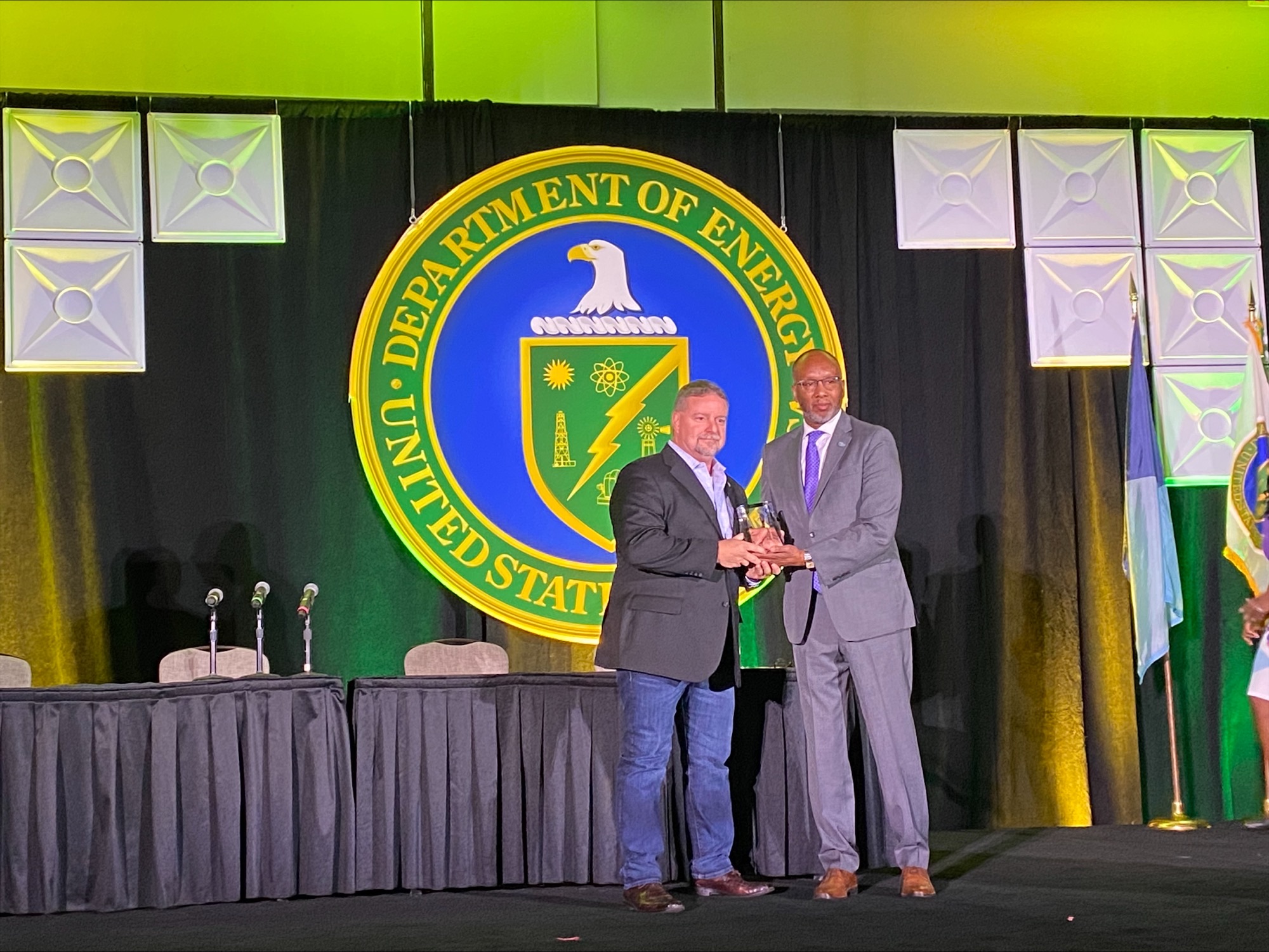 Paul Farless, president and CEO of SDV Construction accepts the Department of Energy’s Service-Disabled Veteran Business of the Year Award for its outstanding work helping Sandia accomplish its mission. Also pictured, Ron Pierce, director of DOE’s Office of Small and Disadvantaged Business Utilization.