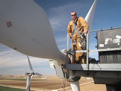 Jon White, a Ph.D. candidate at Purdue University, conducts a field test on one of the Sandia experimental wind turbines in Bushland, Texas. (Photo by Mark Rumsey).<br />
Media are welcome to download/publish this image with related news stories. Click the image to download a 300 dpi JPEG.
