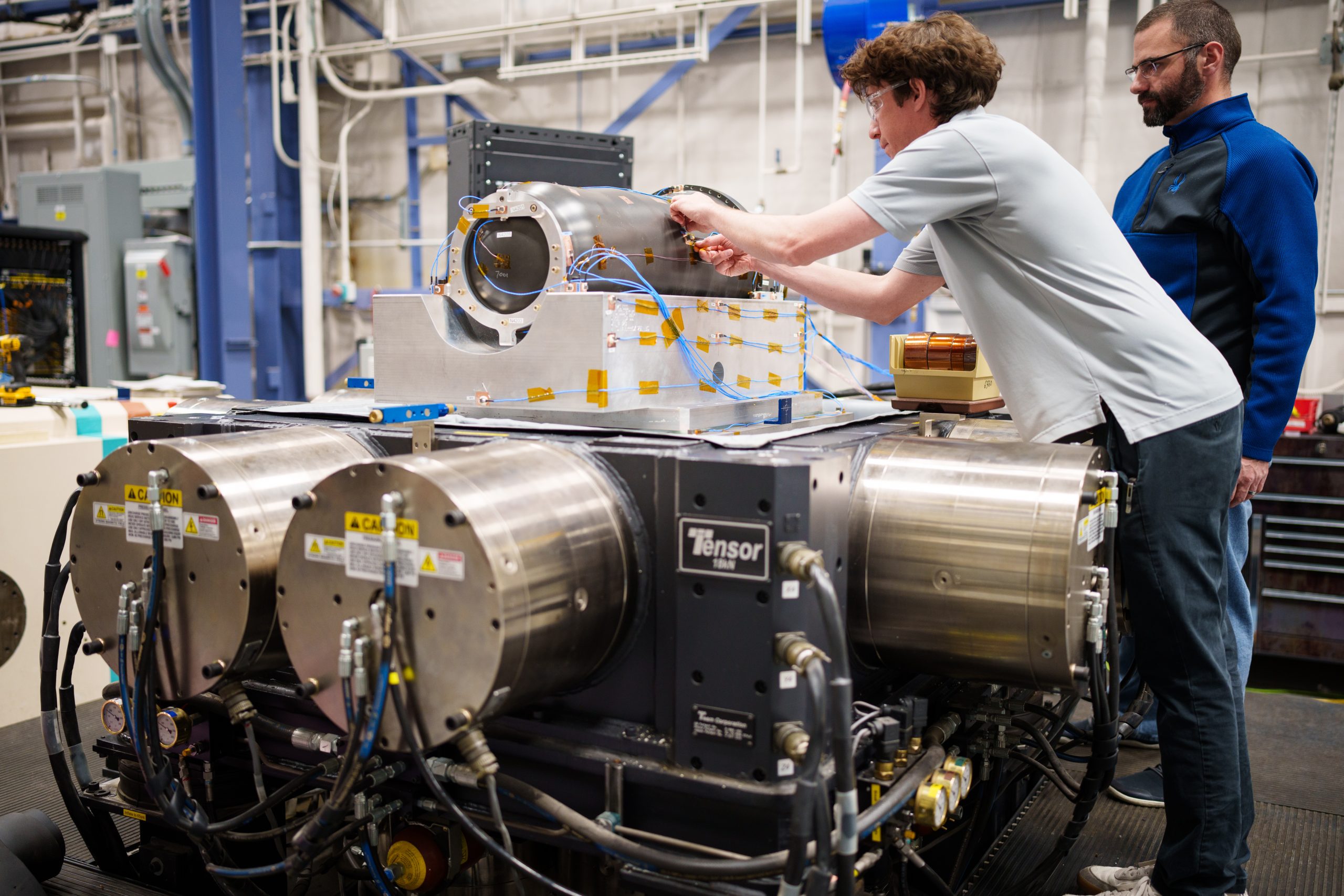 Engineers set an inert W80-4 on the six degrees of freedom shaker table at Sandia National Laboratories.