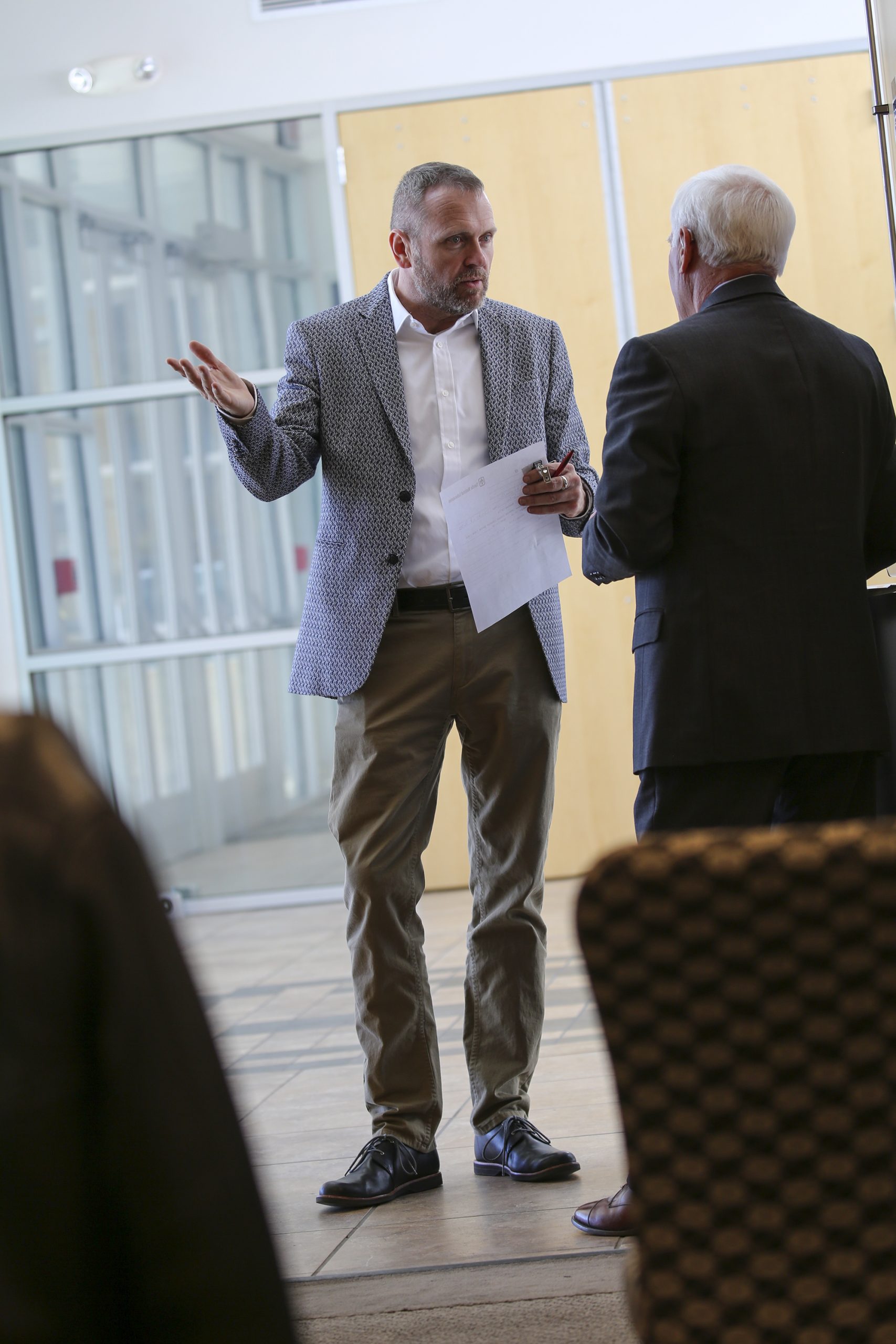 Sandia National Laboratories small-business advocate Eric Lochausen talks to a potential supplier at a recent open house. “People want to meet with us, and we thought it would be best to set up specific hours where we can devote our attention to small, diverse suppliers,” he said.