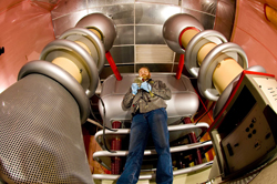 Bruce McWatters prepares Sandia's Cockroft Walton accelerator for its move to the Ion Beam Laboratory. The IBL will be available to Sandia university and industry partners as an official user facility. Although the device seen here dates from the 1950s, it still finds use in certain particle accelerator applications/experiments. Media are welcome to download/publish this image with related news stories. Click the image to download a 300 dpi JPEG.
