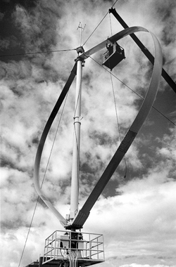A Sandia team completes installation in the late 1980s of a vertical axis wind turbine test platform in Bushland, Texas.