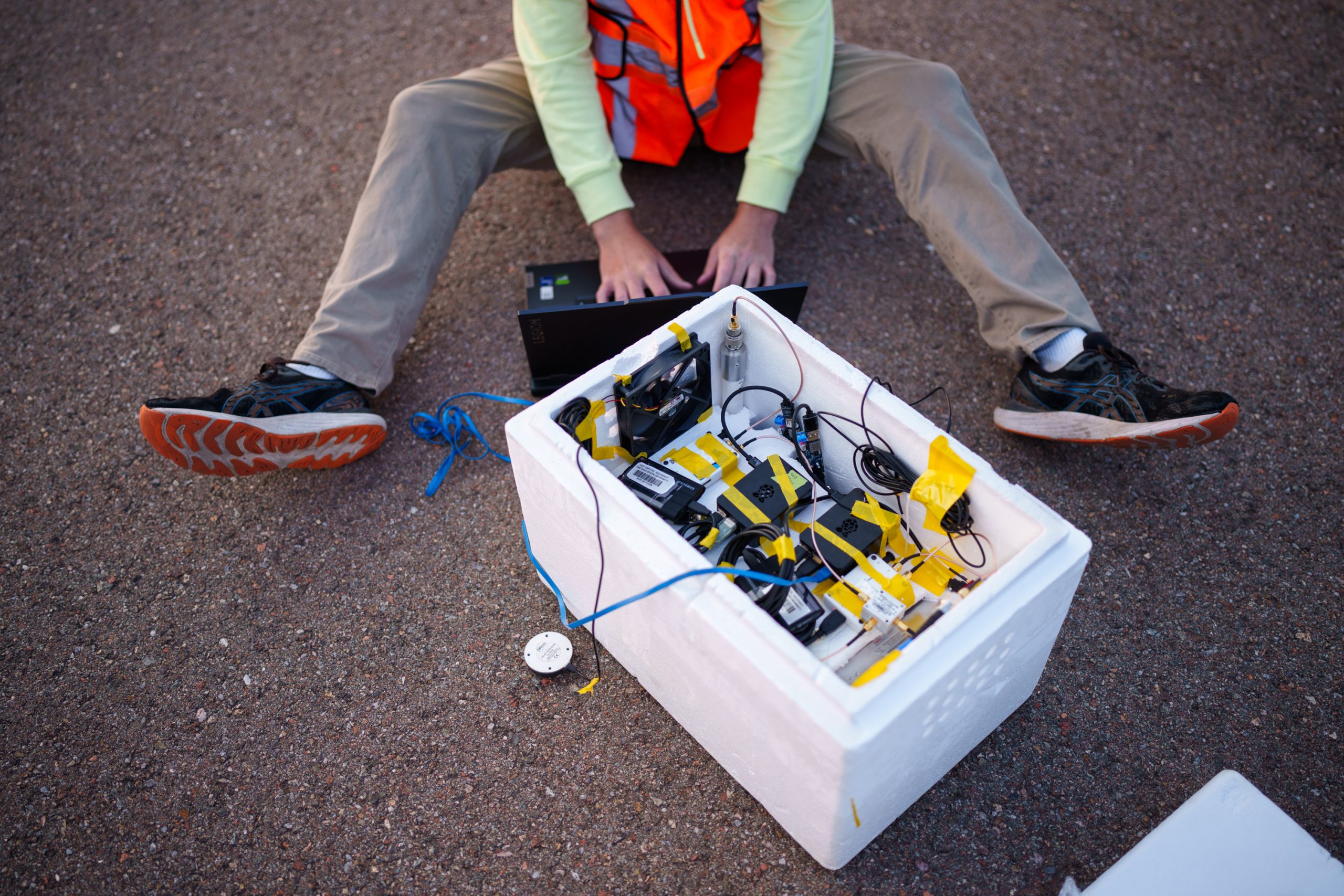 Sandia National Laboratories intern Will Barrett prepares the payload for launch. The payload records GPS and non-GPS signals. After the flight, researchers compare their calculations from non-GPS signals to the actual positions.