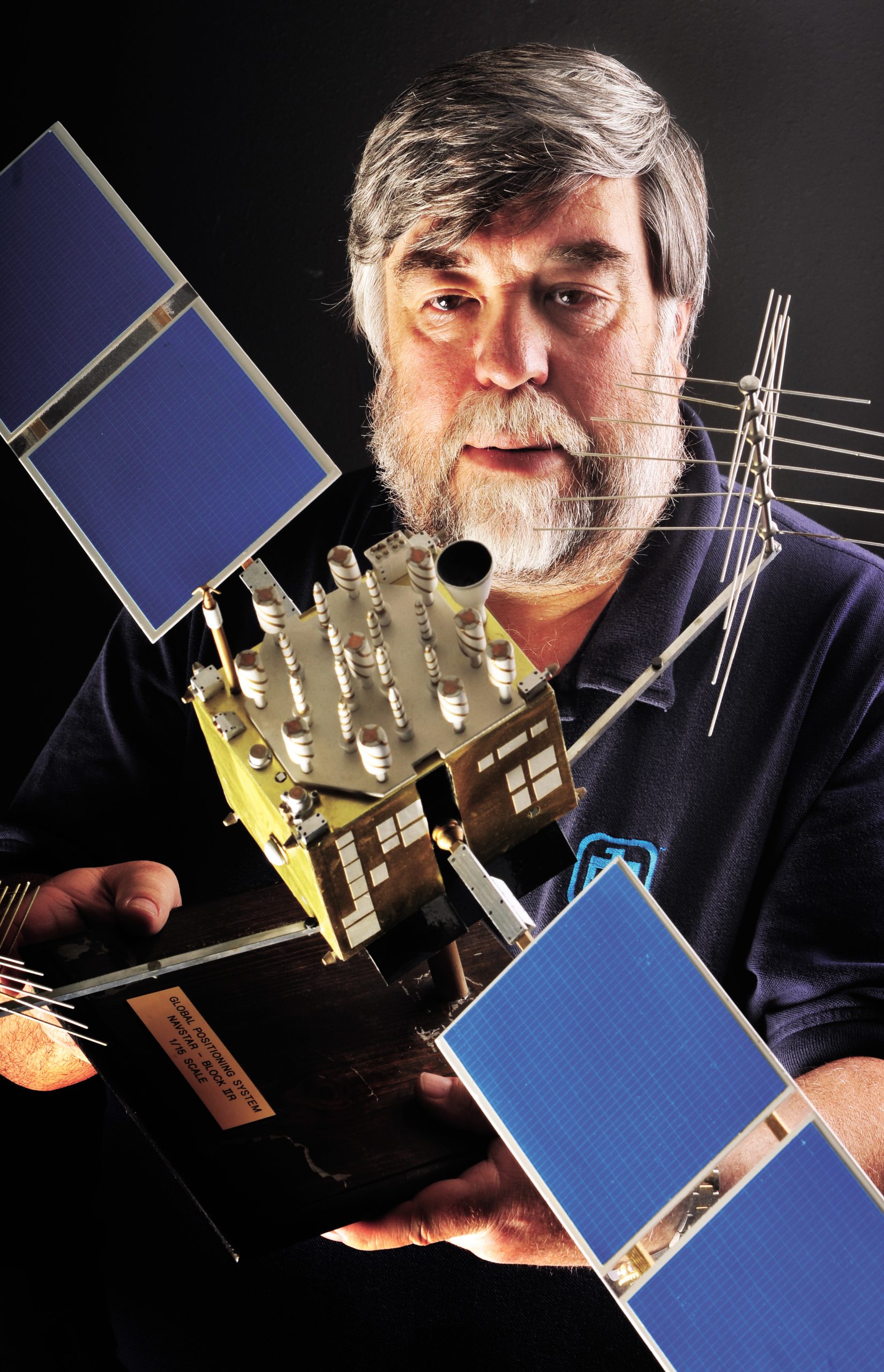 Sandia engineer Steve Yearout displays a 1/15 scale model of a NAVSTAR Block IIR GPS satellite. (Photo by Randy Montoya)<br />
Download 300dpi 7.4 MB JPEG image (Media are welcome to download/publish this image with related news stories.)