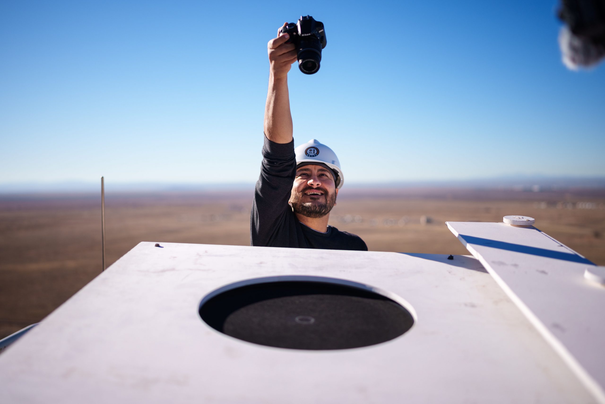 NASA engineer Milad Mahzari documents the status of the heat shield material after a December 2023 test at Sandia National Laboratories. 