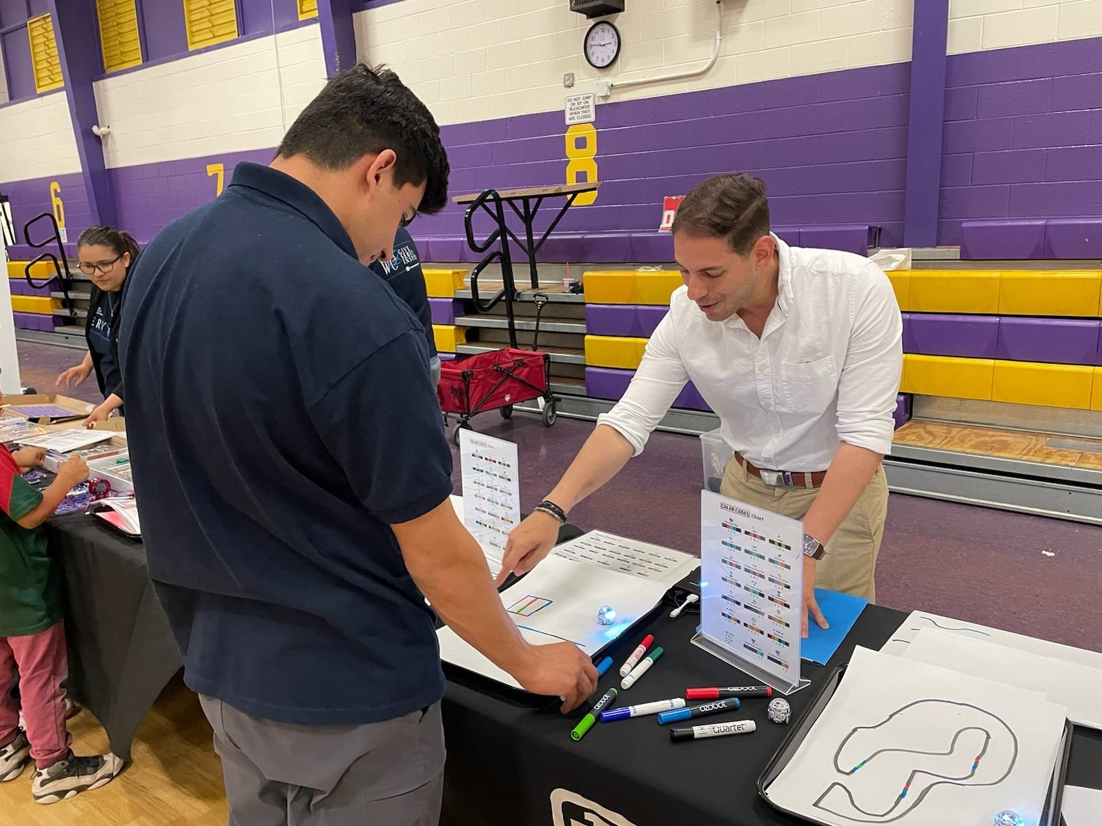 Sandia National Laboratories electrical engineer Rachid Darbali-Zamora volunteers at Garfield Middle school in Albuquerque New Mexico as part of Hispanic Outreach for Leadership Awareness’s Noche de Ciencias.