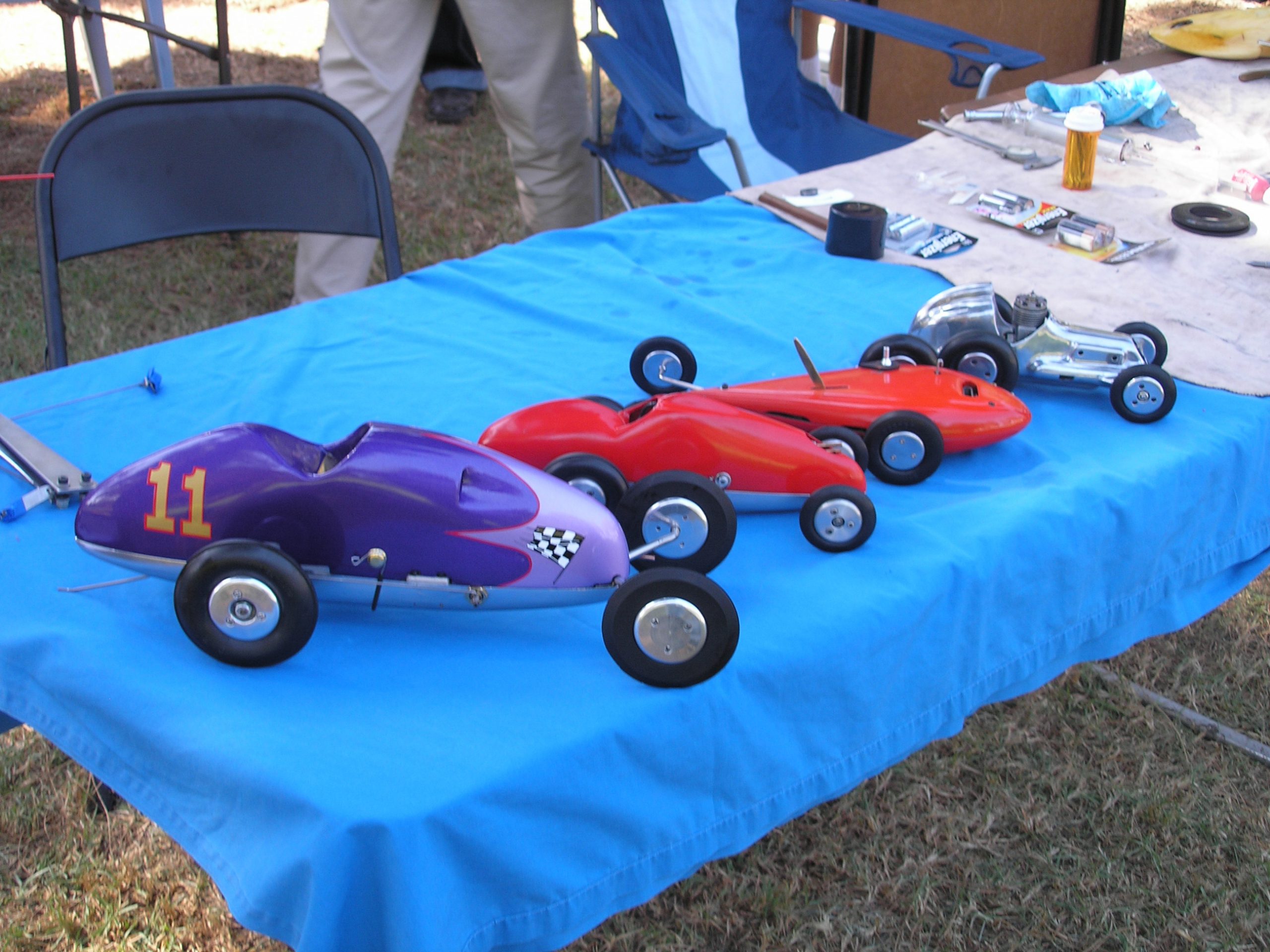 WHICH IS THE COPY?  Ed has owned cars 2, 3, and 4 (from left) for more than 50 years.  The left-most car is a replica of one owned by Ed's dad in the late 1940s; Ed did the rebuilding himself<br />
Download 300dpi 2.5MB JPEG<br />
<br />
(Media are welcome to download/publish this image with related news stories.)