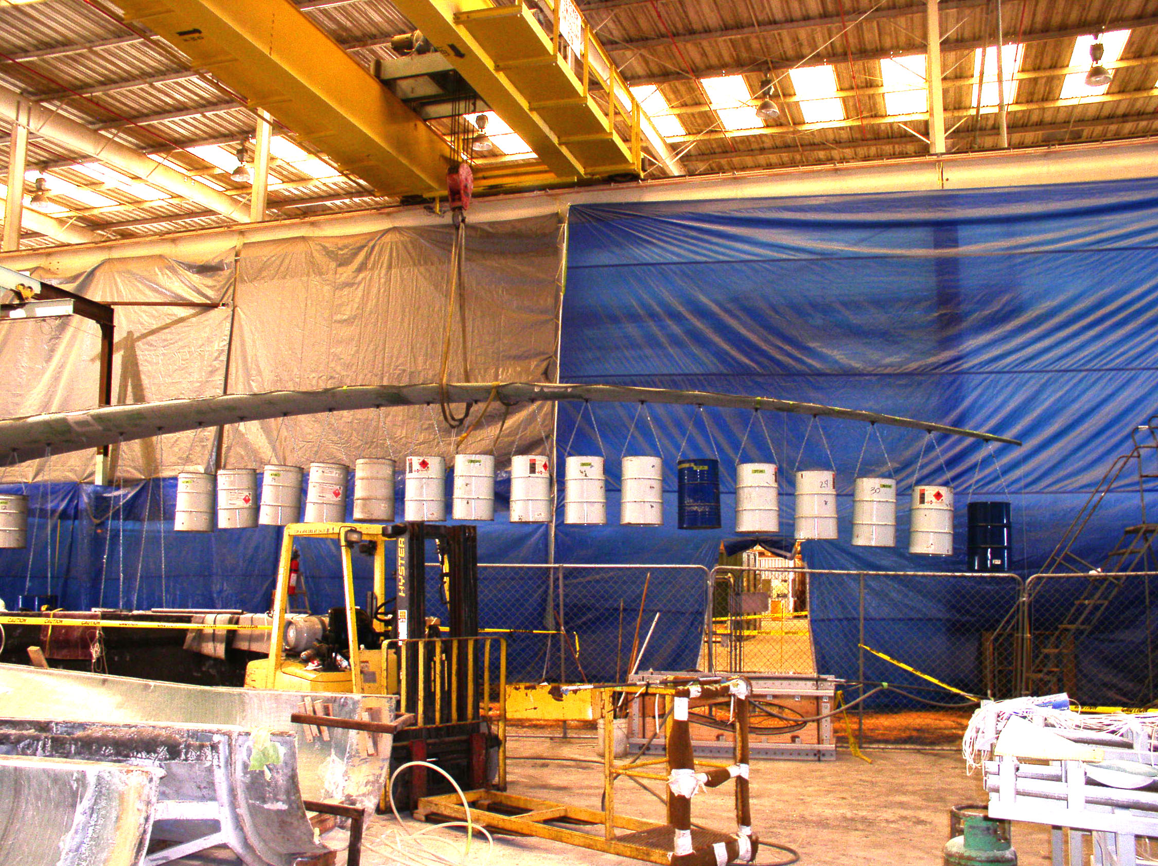 PROOF LOAD TESTING on new Sweep Twist Adaptive Rotor blade using 55-gallon drums to test blade strength.