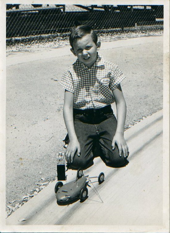EXACTLY THE SAME - In these two pictures of Ed Baynes  -- after the Nationals competition at Anderson, Ind. in 1956, and after the same event held in the same place 50 years later -- the car is the same.  Ed of today, however, demonstrates better posture and cool sunglasses, if slightly stiffer knees.<br />
<br />
Download 300dpi 1.20MB JPEG( young Ed)<br />
Download 300dpi 2.5MB JPEG (Ed Sr.)<br />
(Media are welcome to download/publish this image with related news stories.) 