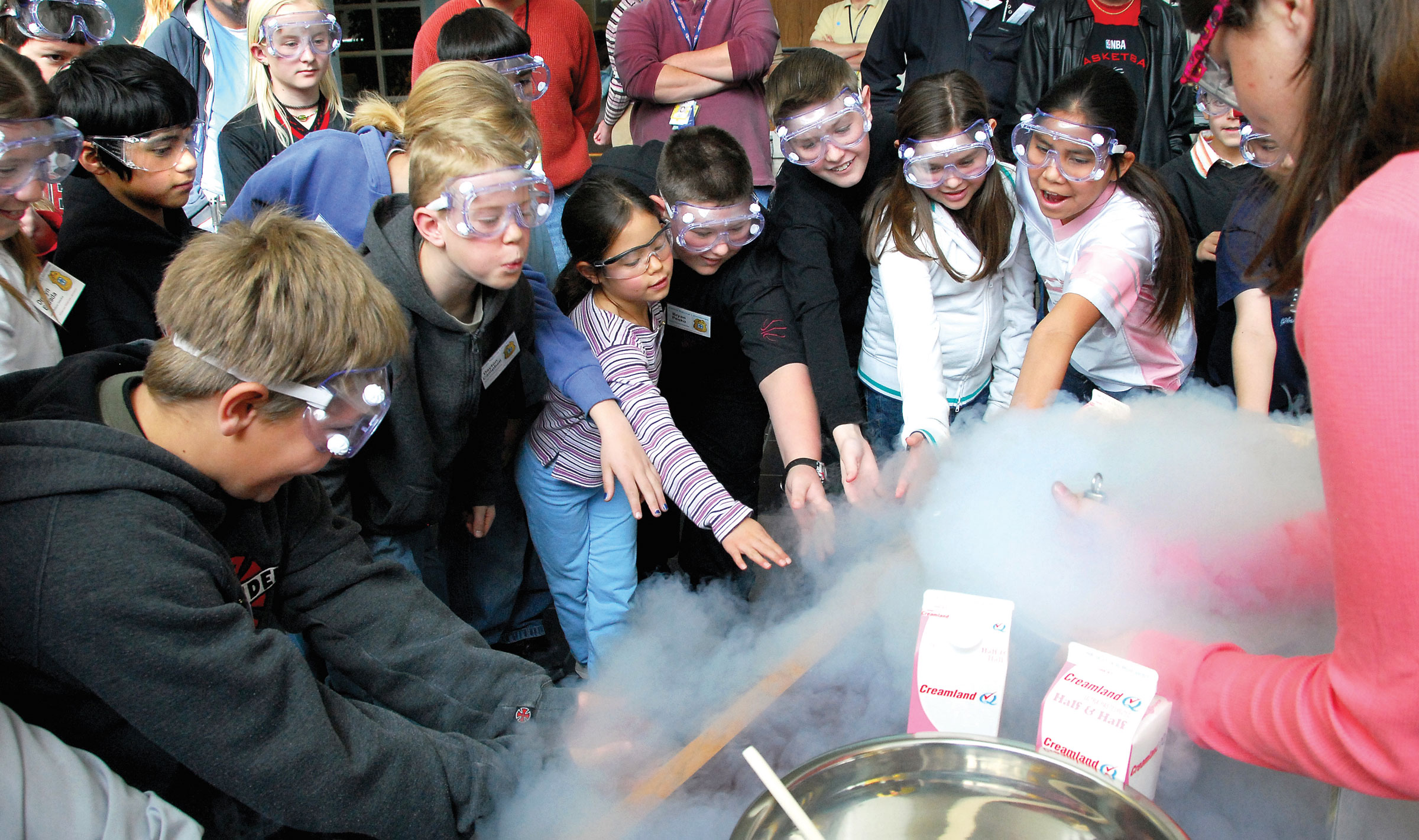 Liquid nitrogen freezes milk products into ice cream. The students here, from Albuquerque’s Bellehaven Elementary School, are participating in a “CSI”-type science lesson.