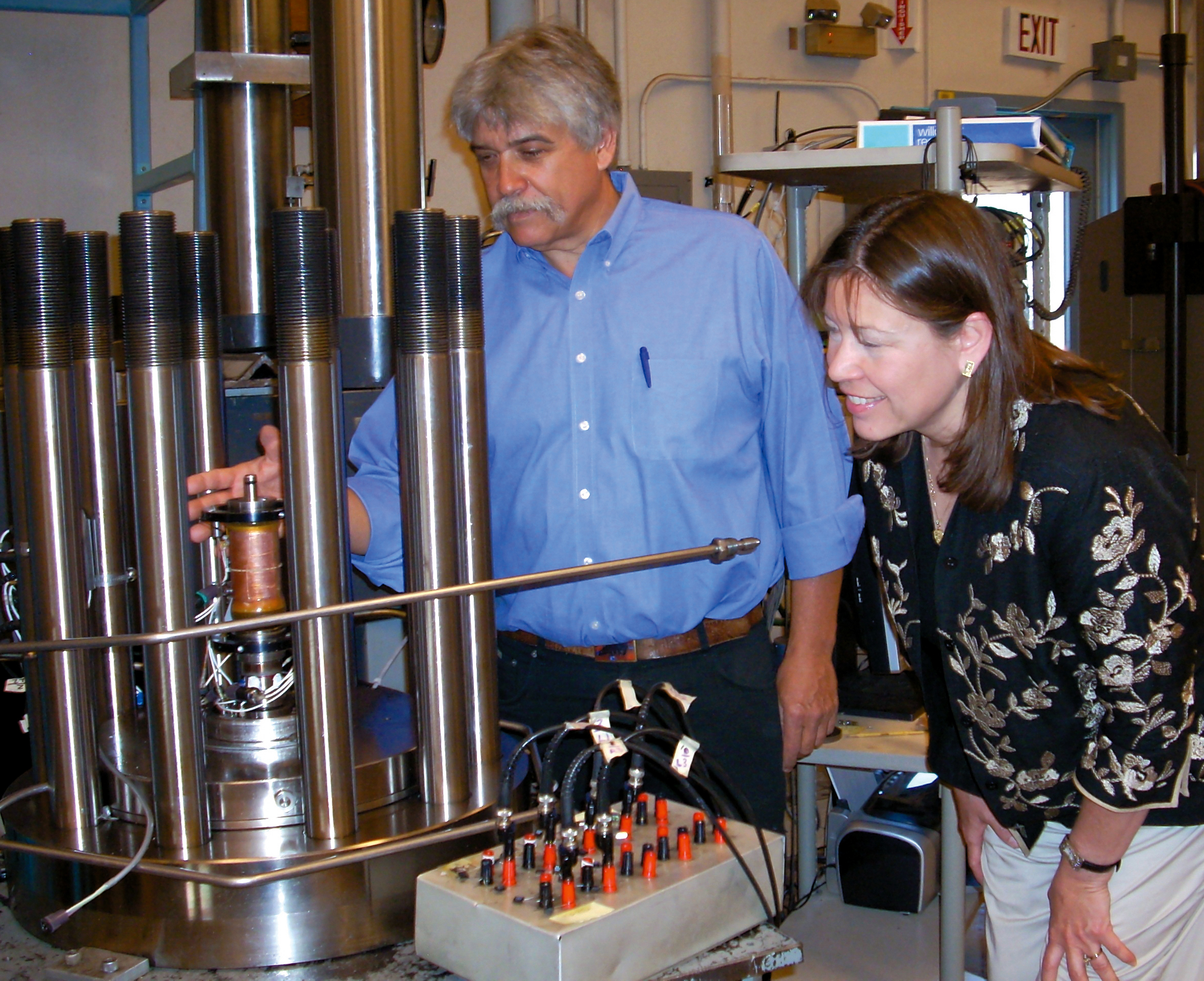 Sandia researchers Steve Bauer and Georgianne Peek look at equipment that will be used to analyze core samples from the potential Iowa aquifer compressed air energy storage site. The data will provide necessary fundamental information used for the design and performance of the underground air storage vessel. (Photo by Chris Burroughs)<br />
Download 300dpi 13MB JPEG image (Media are welcome to download/publish this image with related news stories.)